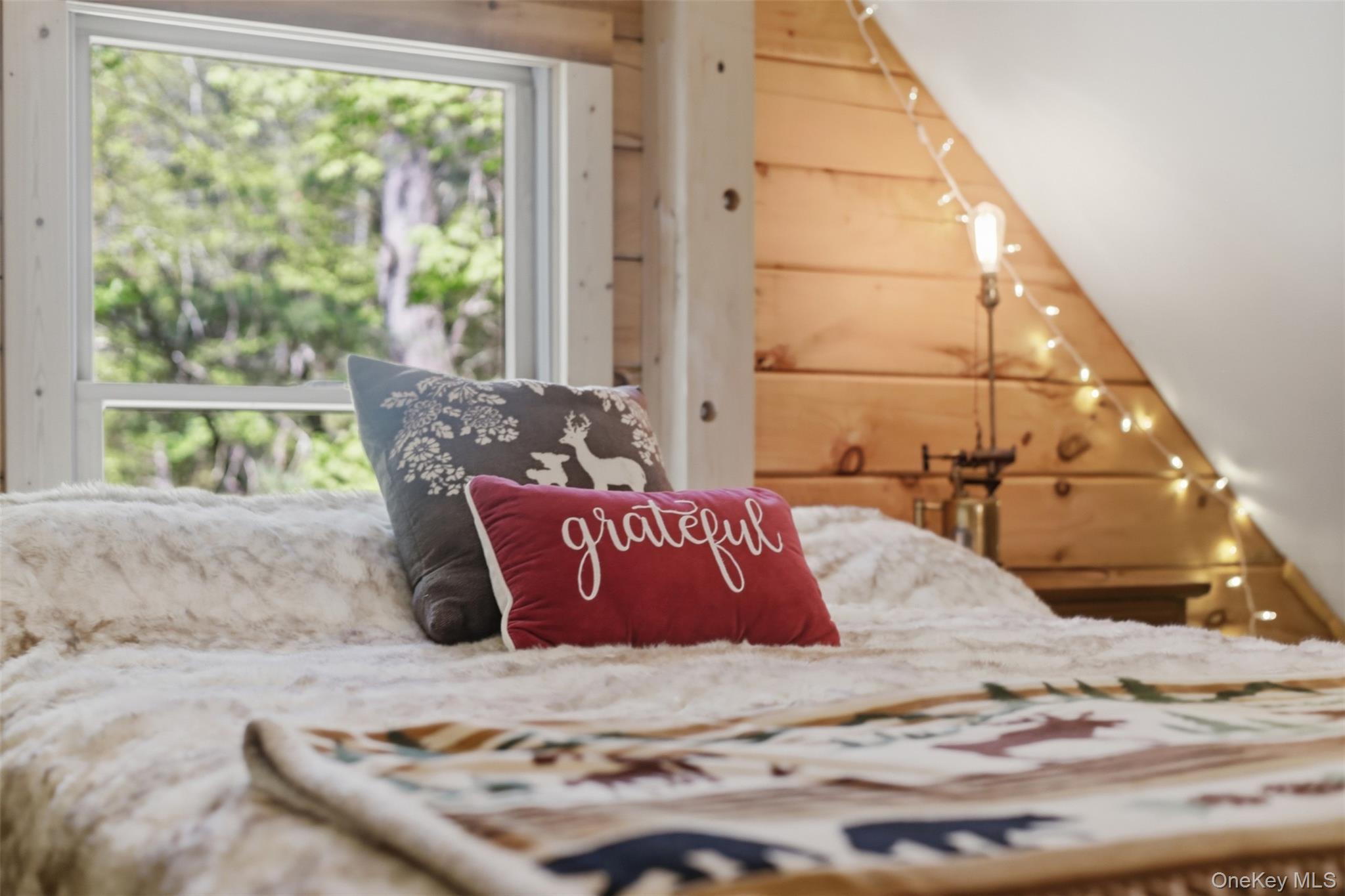 301 Pucky Huddle Road Bethel, NY 12720 - Photo 25 of 39 Up the pull ladder is the large loft with window. A fun flexible space perfect for your home office, hobbies or your guests.