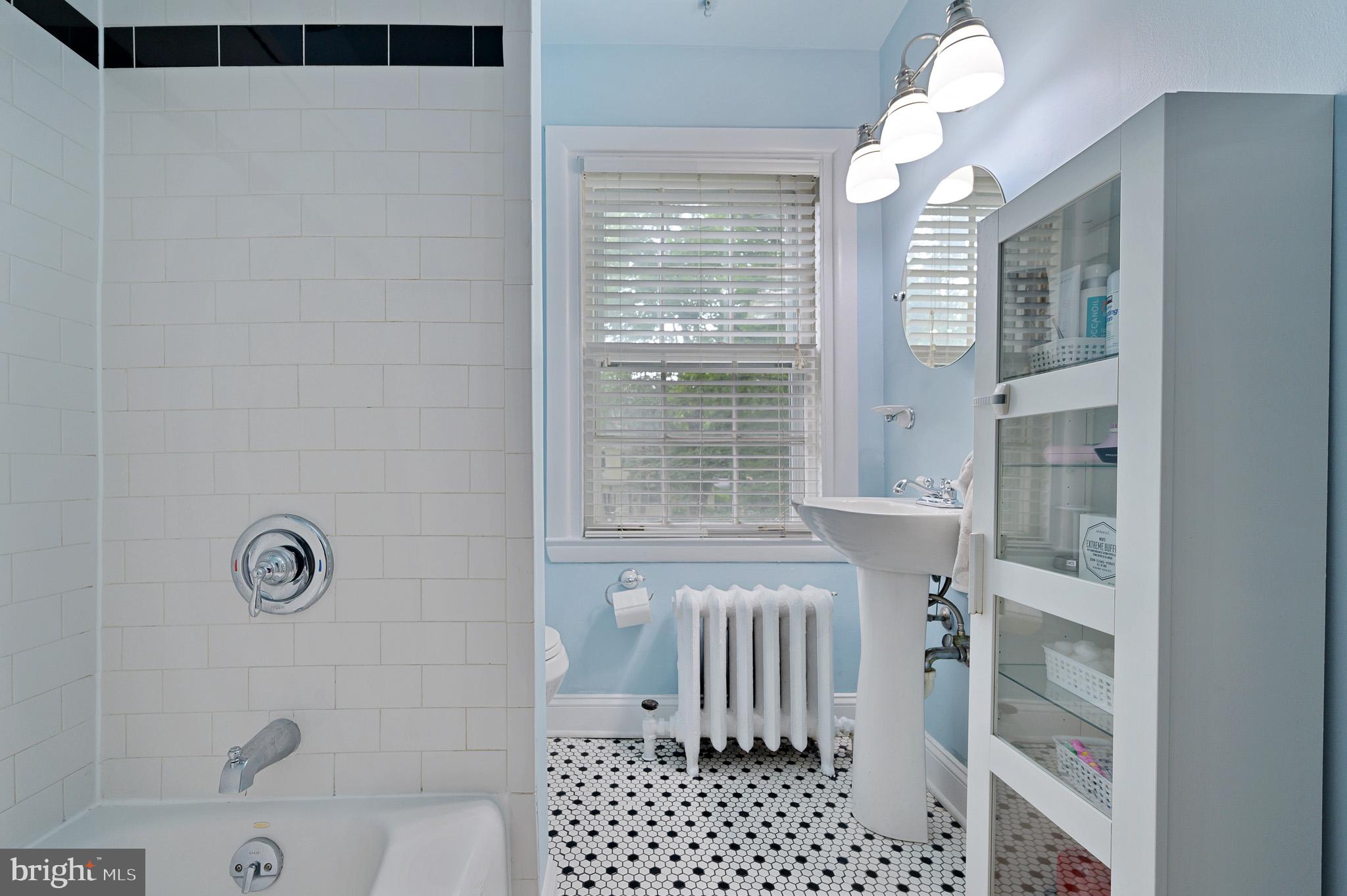 711 Nottingham Road Wilmington, DE 19805 - Photo 13 of 20 Hall bathroom with the retro black and white tile