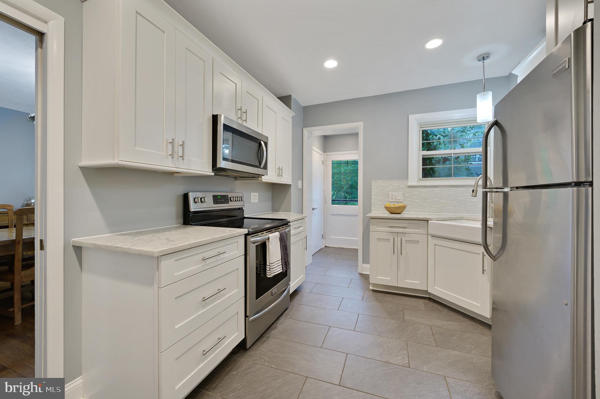 711 Nottingham Road Wilmington, DE 19805 - Photo 7 of 20 Beautifully updated kitchen with quartz counters