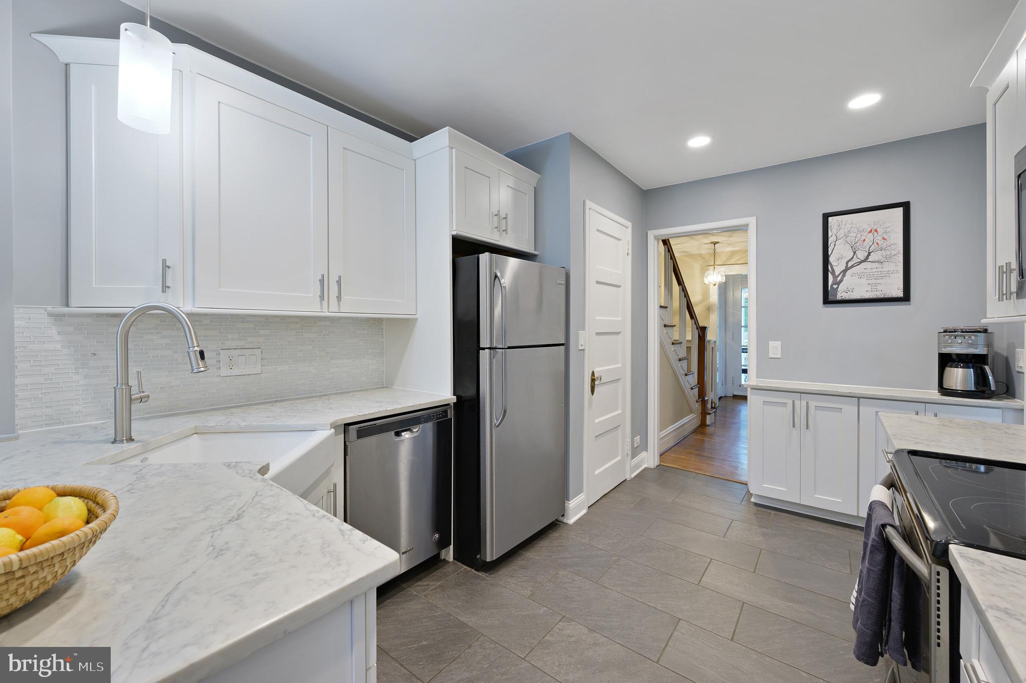 711 Nottingham Road Wilmington, DE 19805 - Photo 8 of 20 Bright white kitchen with stainless appliances