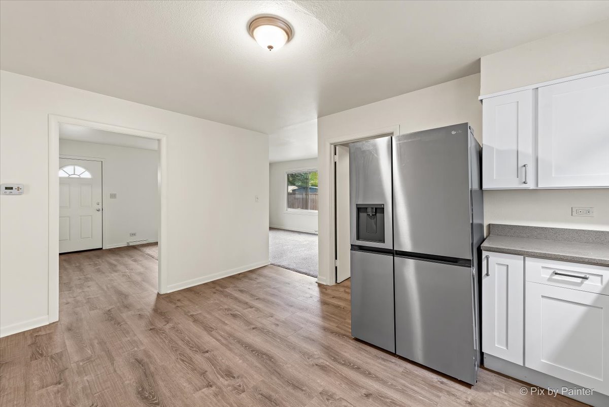 288 North Addison Road Wood Dale, IL 60191 - Photo 13 of 23 a kitchen with stainless steel appliances a refrigerator and wooden cabinets