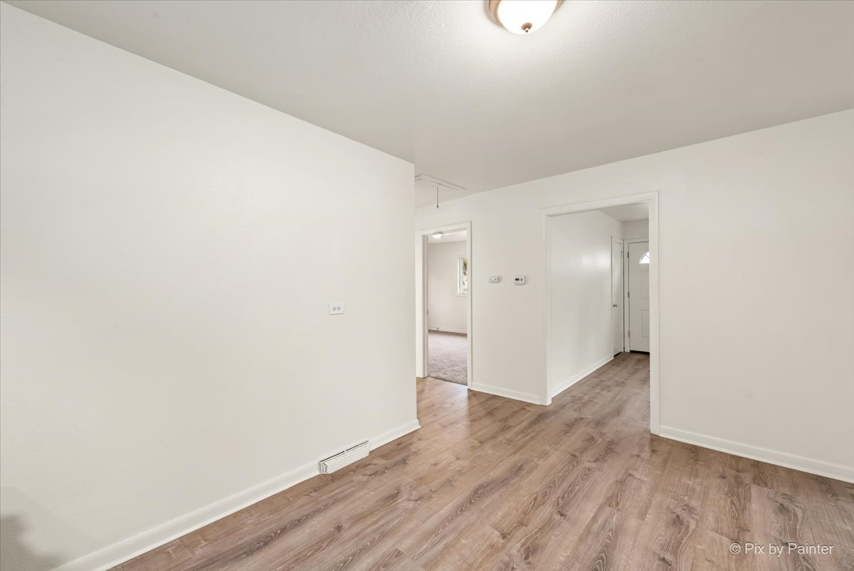 288 North Addison Road Wood Dale, IL 60191 - Photo 14 of 23 a view of an empty room with wooden floor