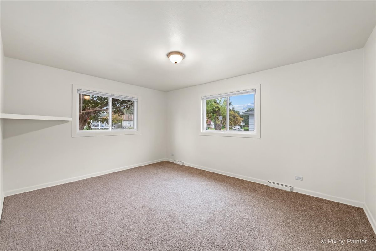 288 North Addison Road Wood Dale, IL 60191 - Photo 18 of 23 a view of an empty room with a window