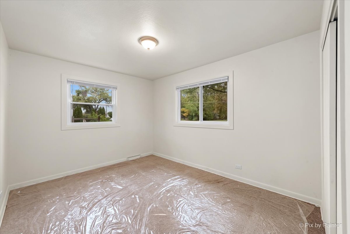 288 North Addison Road Wood Dale, IL 60191 - Photo 20 of 23 a view of a bedroom with bed and a window
