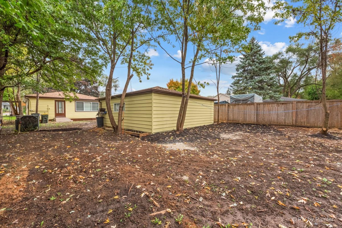 288 North Addison Road Wood Dale, IL 60191 - Photo 22 of 23 a backyard of a house with a large tree