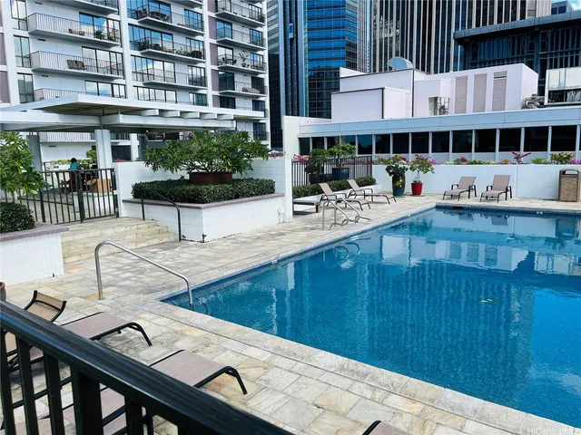 a view of a patio with dining table and chairs