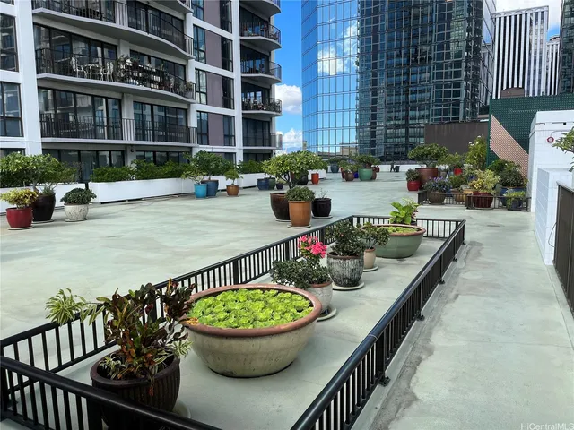 a view of a swimming pool with outdoor seating