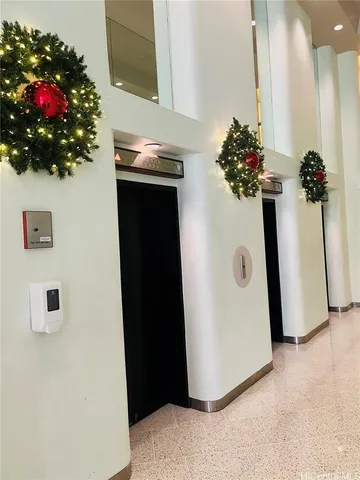 a vase of flowers sitting on a floor