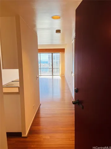 a view of an empty room with a window