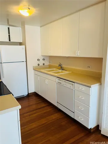 a kitchen with a sink and cabinets