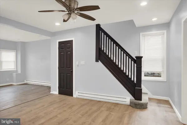 an entryway in a hall with a window