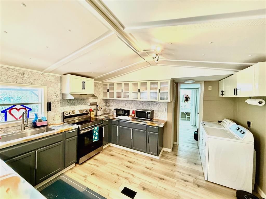208 Ashley Street Hawthorne, FL 32640 - Photo 11 of 32 a kitchen with granite countertop lots of counter top space and stainless steel appliances