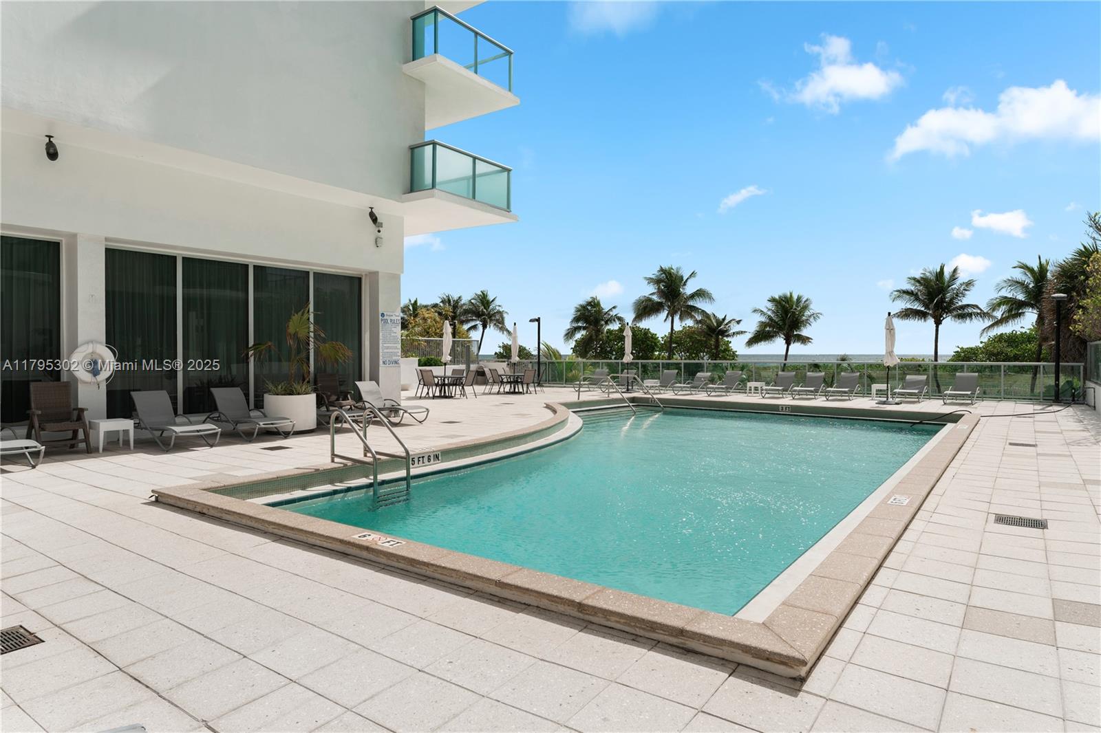 9511 Collins Avenue, Unit 301 Surfside, FL 33154 - Photo 12 of 15 a view of a swimming pool with a patio