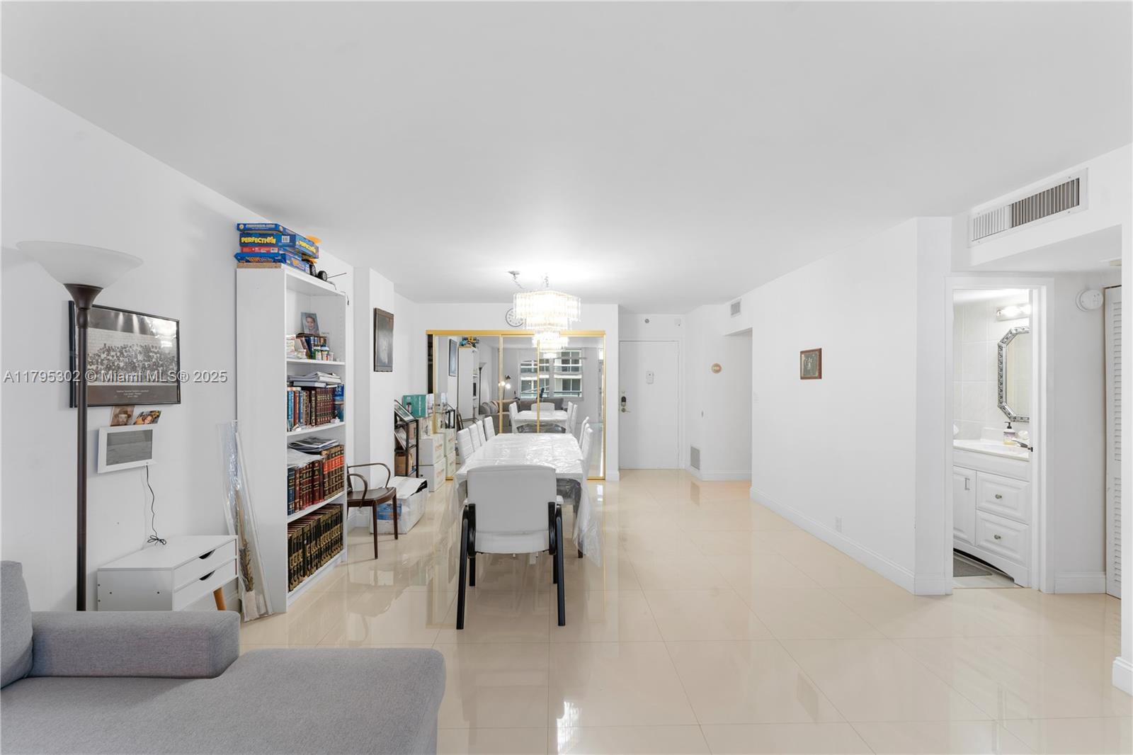 9511 Collins Avenue, Unit 301 Surfside, FL 33154 - Photo 5 of 15 a living room with furniture and a area