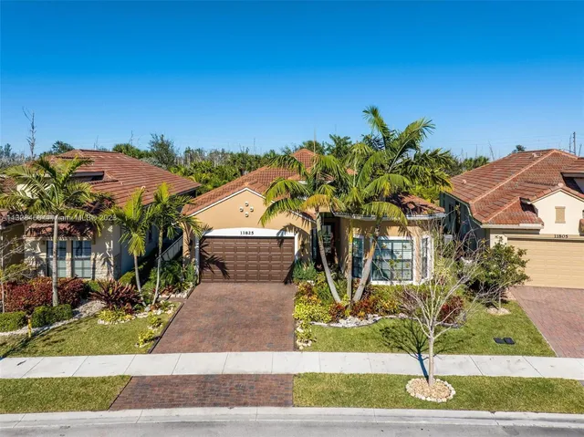 a view of a kitchen with a table and chairs