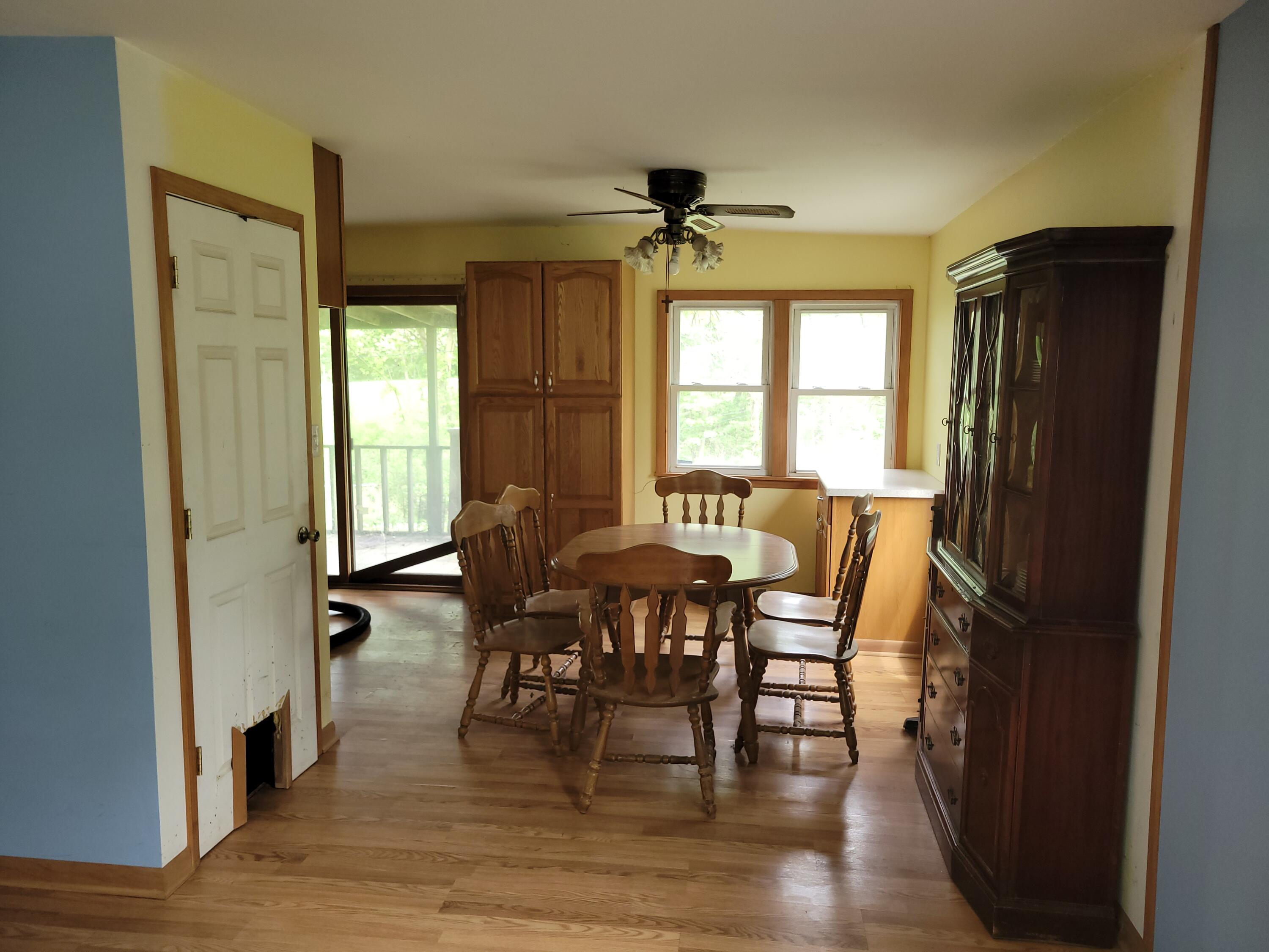 63 Deerpath Road Merrillville, IN 46410 - Photo 5 of 14 a view of a a dining room with furniture window and wooden floor