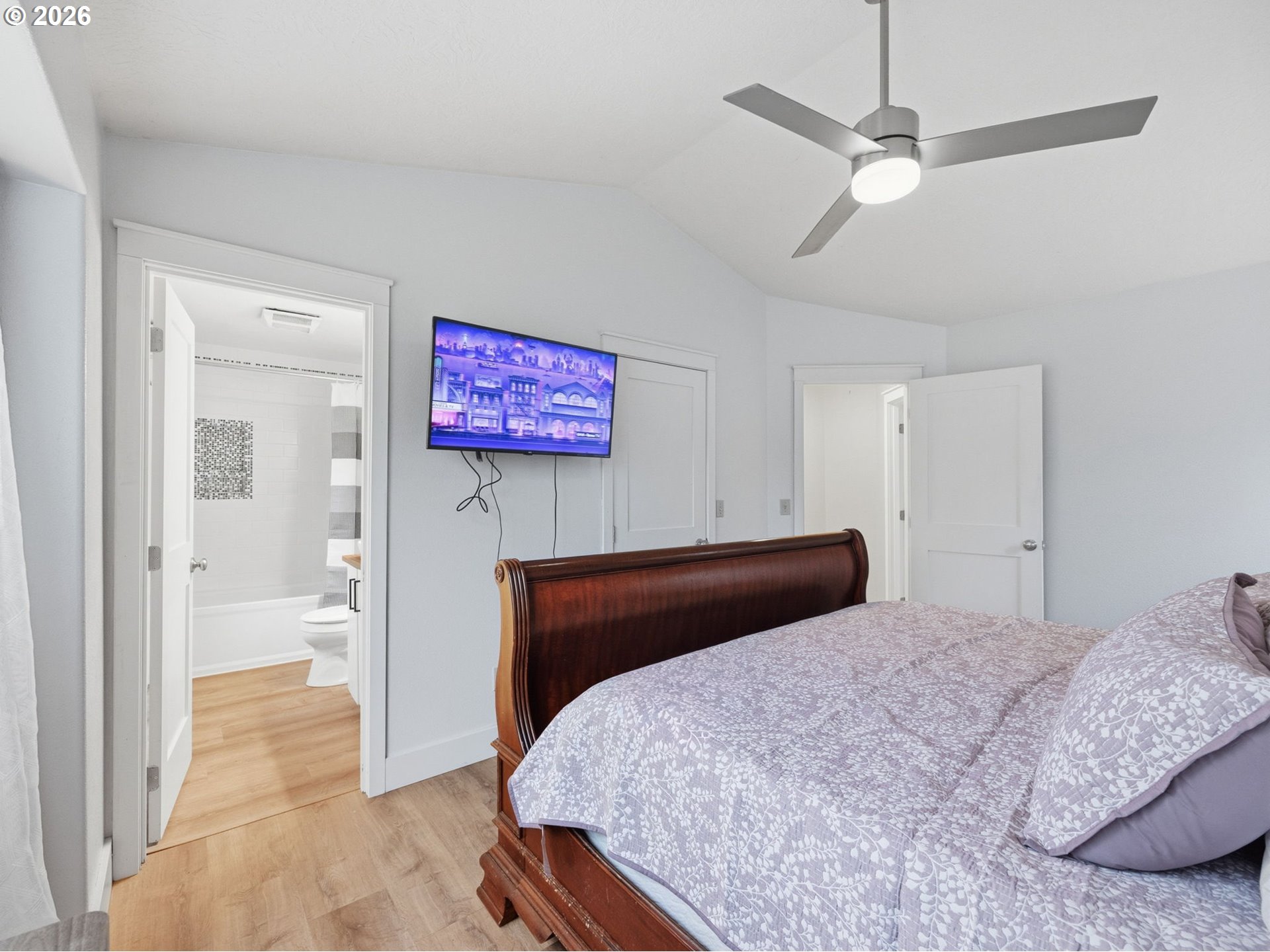 92085 Akerstedt Road Astoria, OR 97103 - Photo 16 of 48 a bedroom with a bed and a view of bathroom