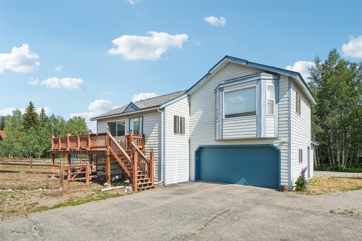 380 Riley Road Silverthorne, CO 80498 - Photo 11 of 49 a view of a house with a yard and a garage