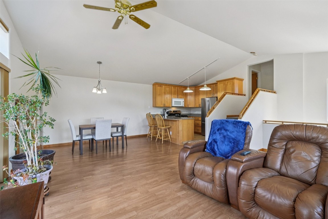 380 Riley Road Silverthorne, CO 80498 - Photo 20 of 49 a living room with furniture kitchen view and a potted plant