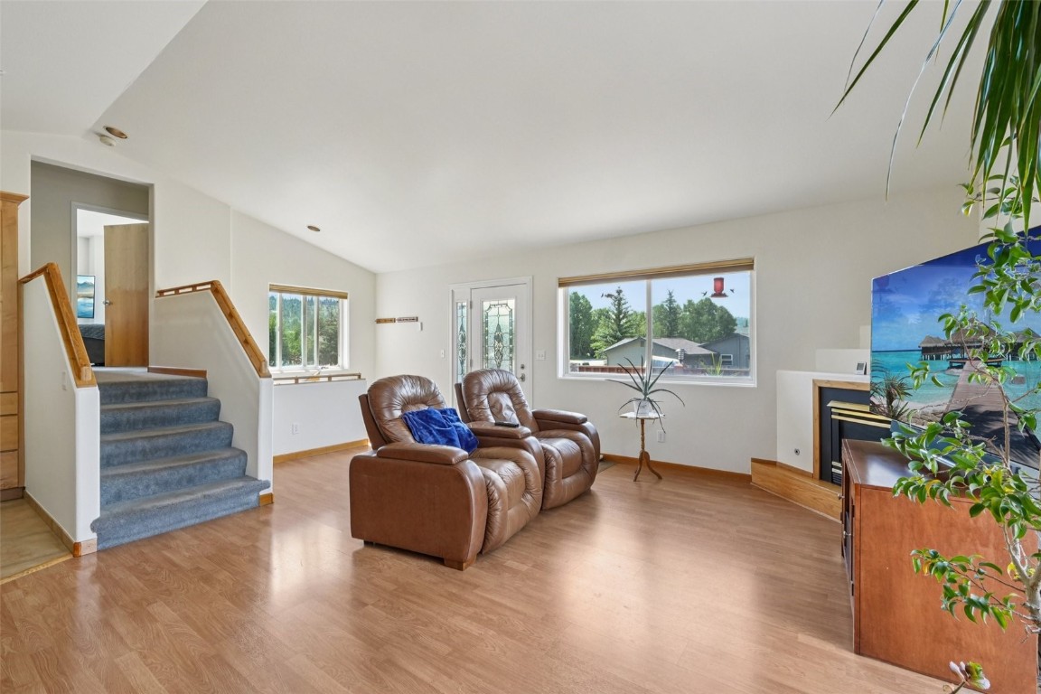 380 Riley Road Silverthorne, CO 80498 - Photo 2 of 49 a living room with furniture a window and wooden floor