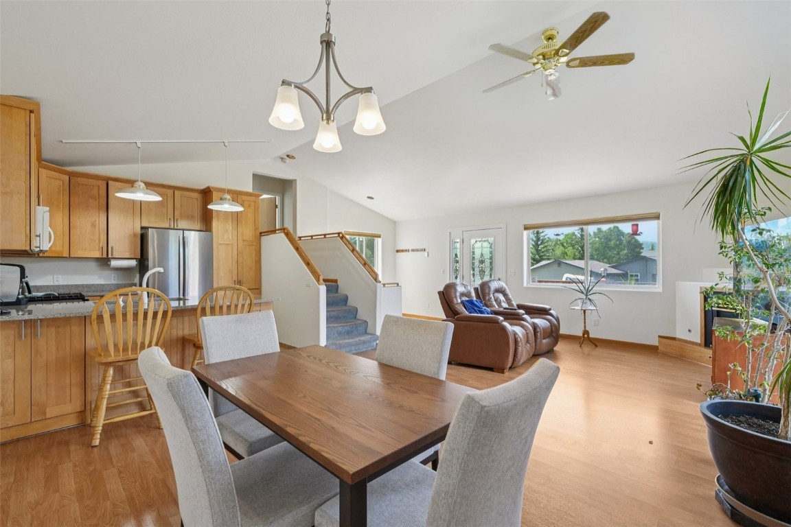 380 Riley Road Silverthorne, CO 80498 - Photo 22 of 49 a living room with furniture a chandelier and a flat screen tv
