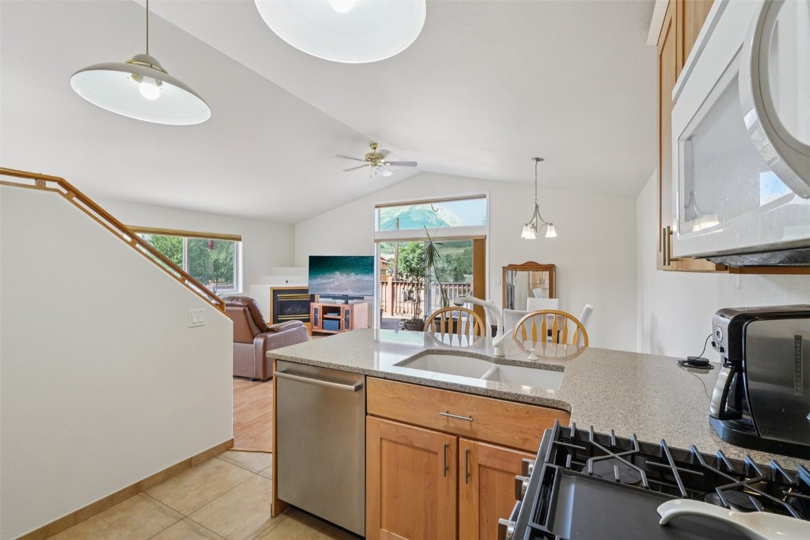 380 Riley Road Silverthorne, CO 80498 - Photo 25 of 49 a kitchen with sink refrigerator and stove