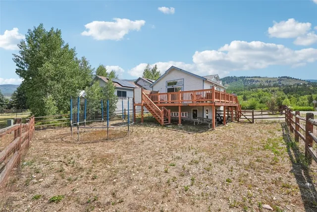 a house with trees in the background