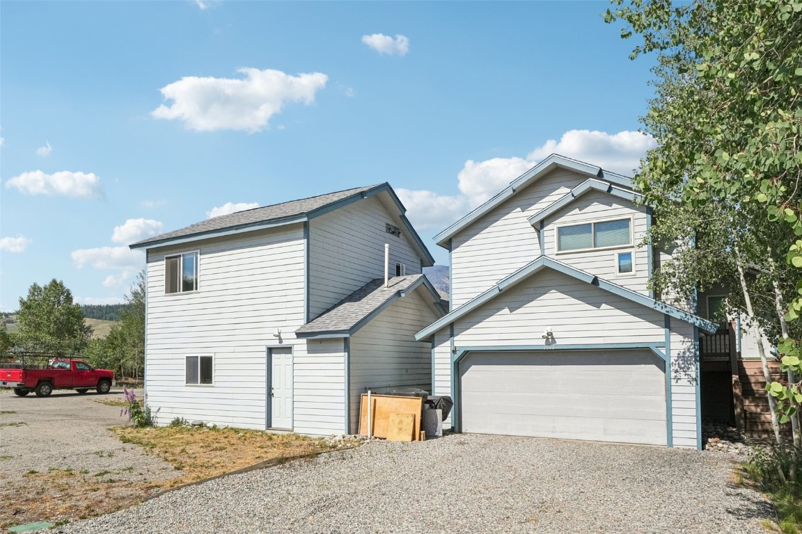 380 Riley Road Silverthorne, CO 80498 - Photo 48 of 49 a front view of a house with a yard and garage