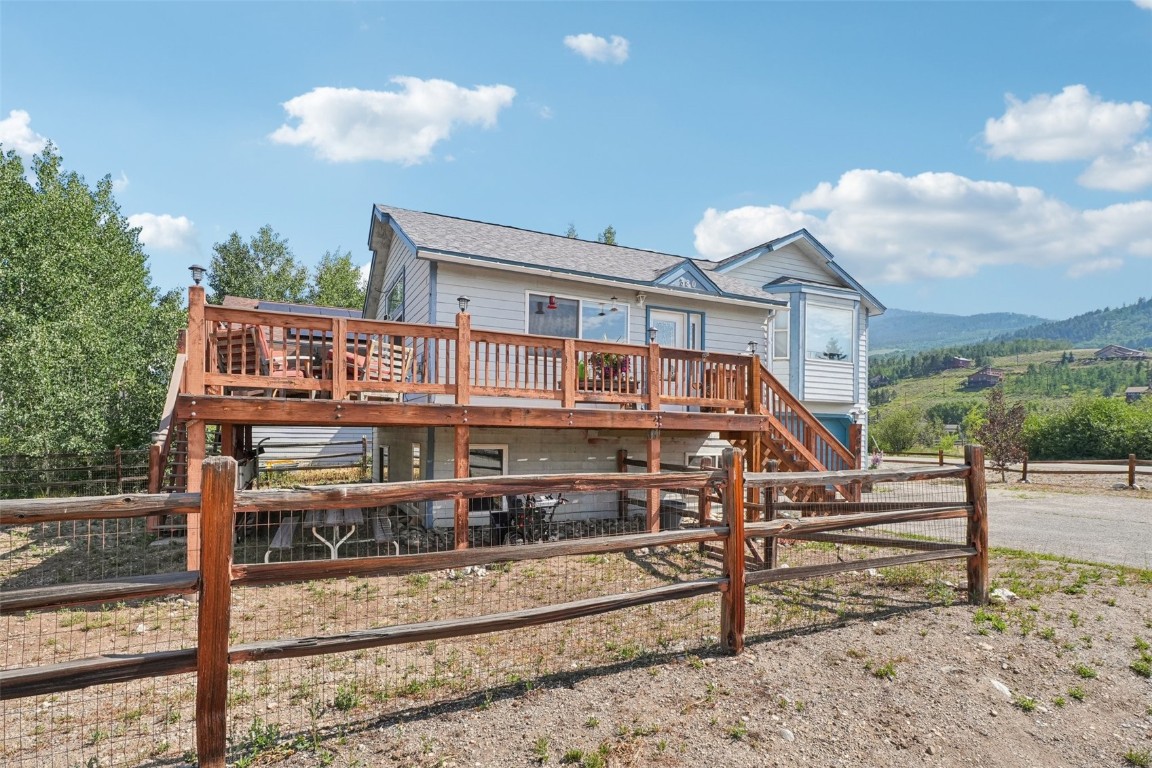 380 Riley Road Silverthorne, CO 80498 - Photo 10 of 49 a view of a white house with a small yard and wooden fence