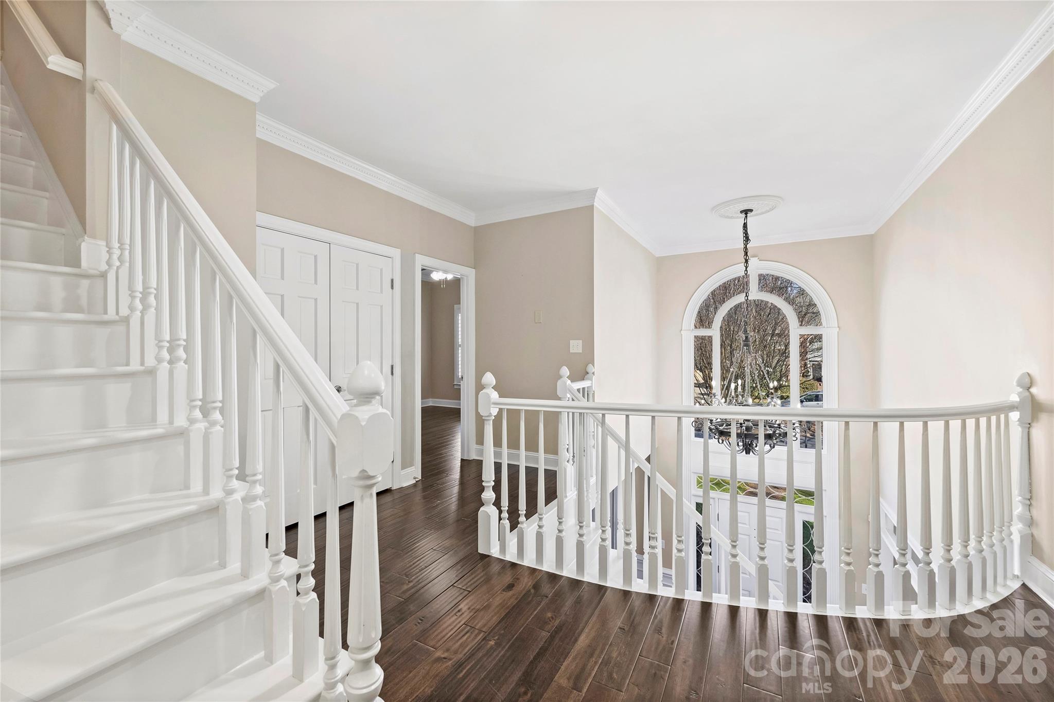 5242 Colony Road Charlotte, NC 28226 - Photo 13 of 34 a view of staircase with wooden floor and white walls