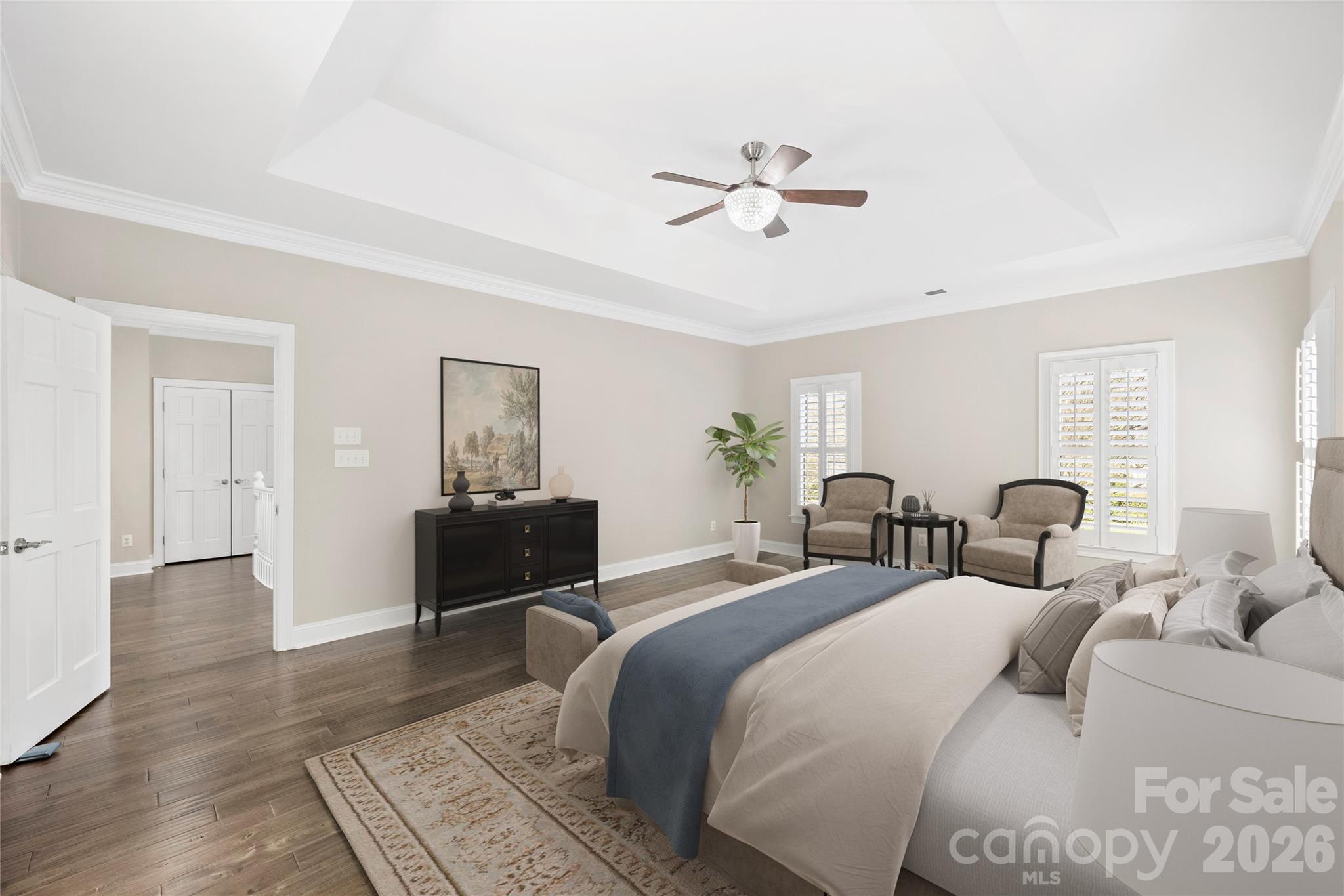 5242 Colony Road Charlotte, NC 28226 - Photo 14 of 34 a bedroom with a bed and wooden floor