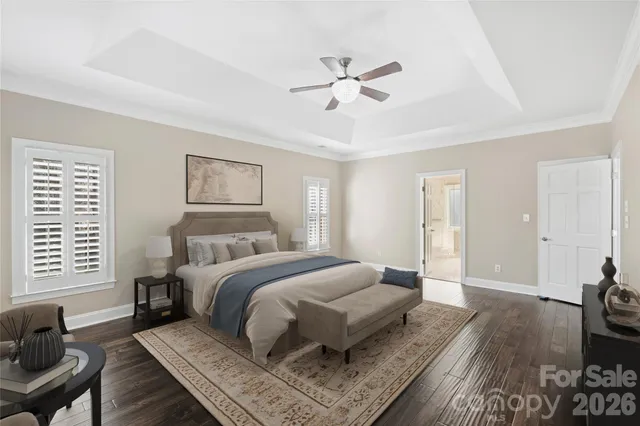 a bedroom with a large bed and a couch