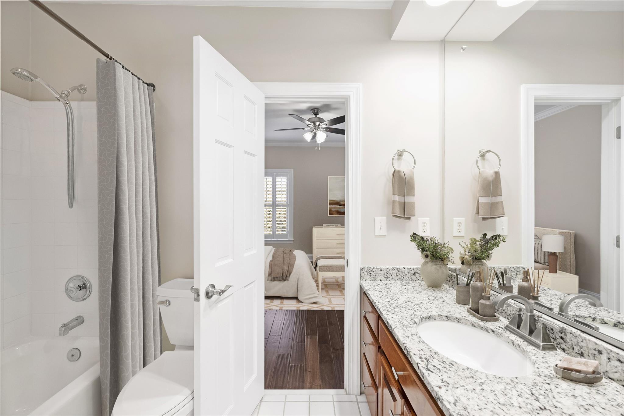 5242 Colony Road Charlotte, NC 28226 - Photo 20 of 34 a large bathroom with a granite countertop tub sink and mirror