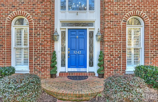 a view of a wooden door with a window