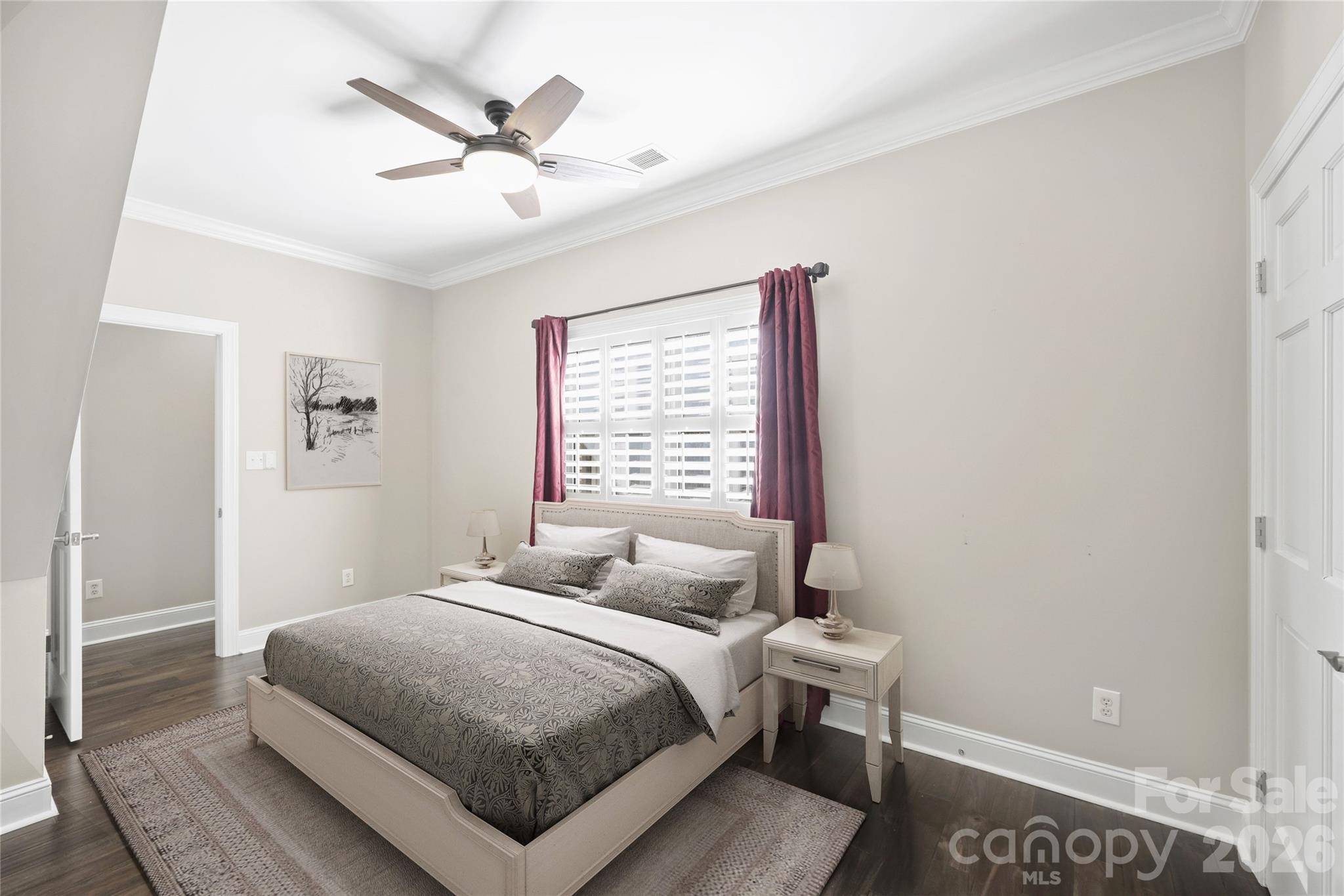 5242 Colony Road Charlotte, NC 28226 - Photo 21 of 34 a bedroom with a bed and window