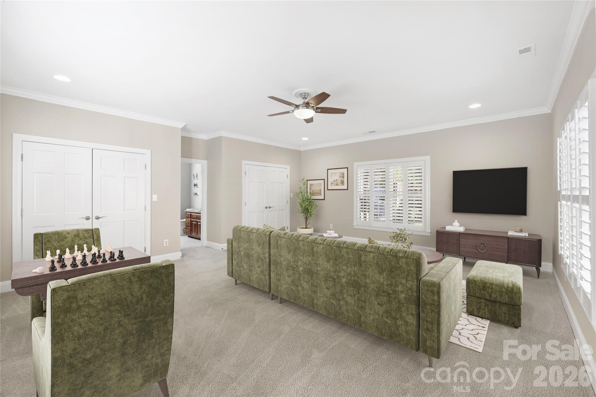 5242 Colony Road Charlotte, NC 28226 - Photo 24 of 34 a living room with furniture and a flat screen tv