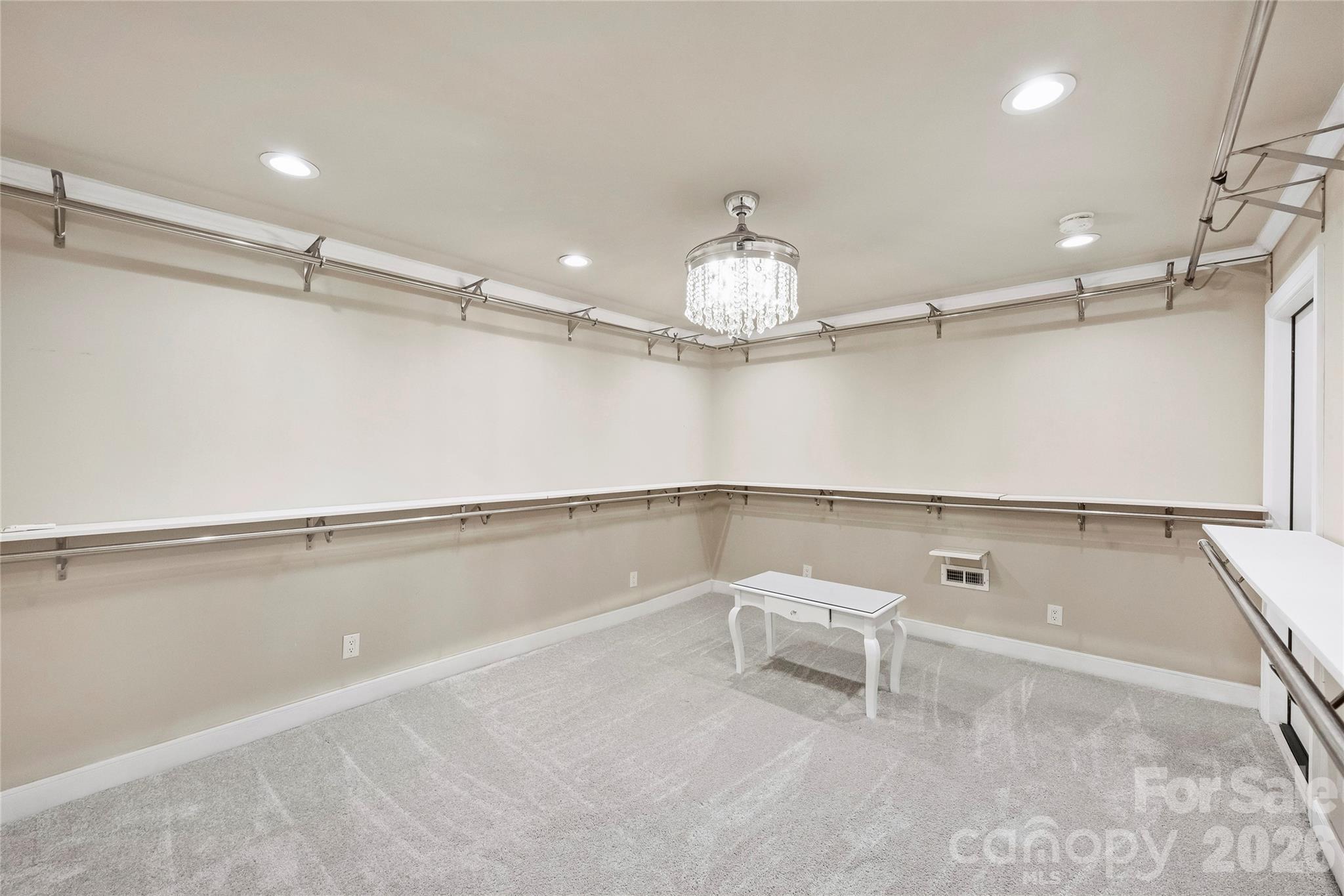 5242 Colony Road Charlotte, NC 28226 - Photo 26 of 34 a view of a room with racks on the wall