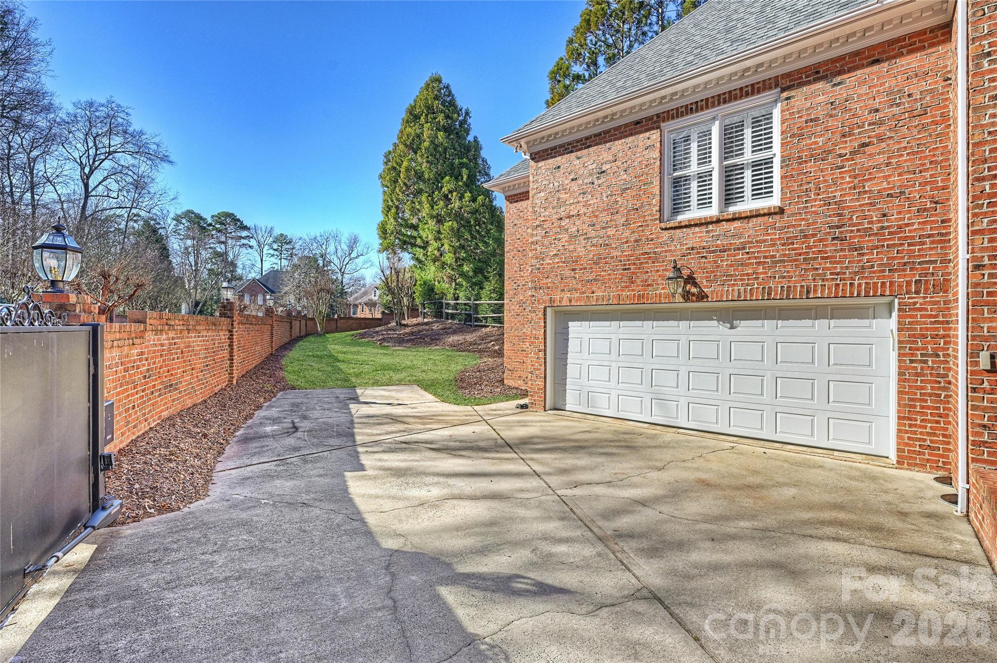 5242 Colony Road Charlotte, NC 28226 - Photo 28 of 34 a front view of a house with a yard and garage
