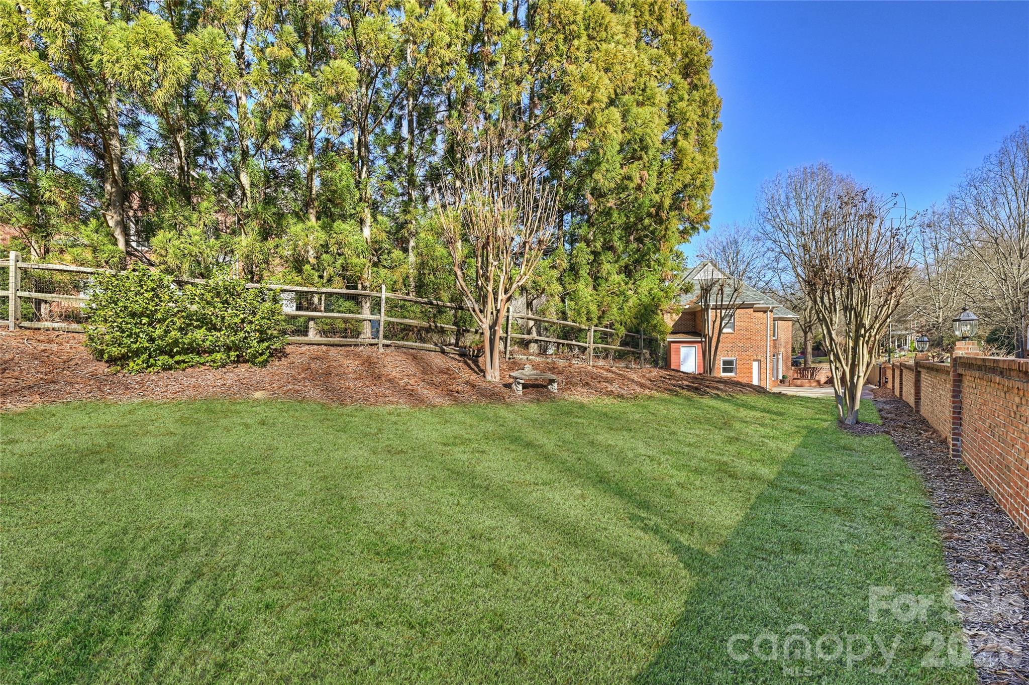 5242 Colony Road Charlotte, NC 28226 - Photo 31 of 34 a view of a backyard with a garden