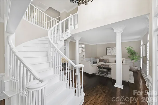 a view of entryway and hall with wooden floor