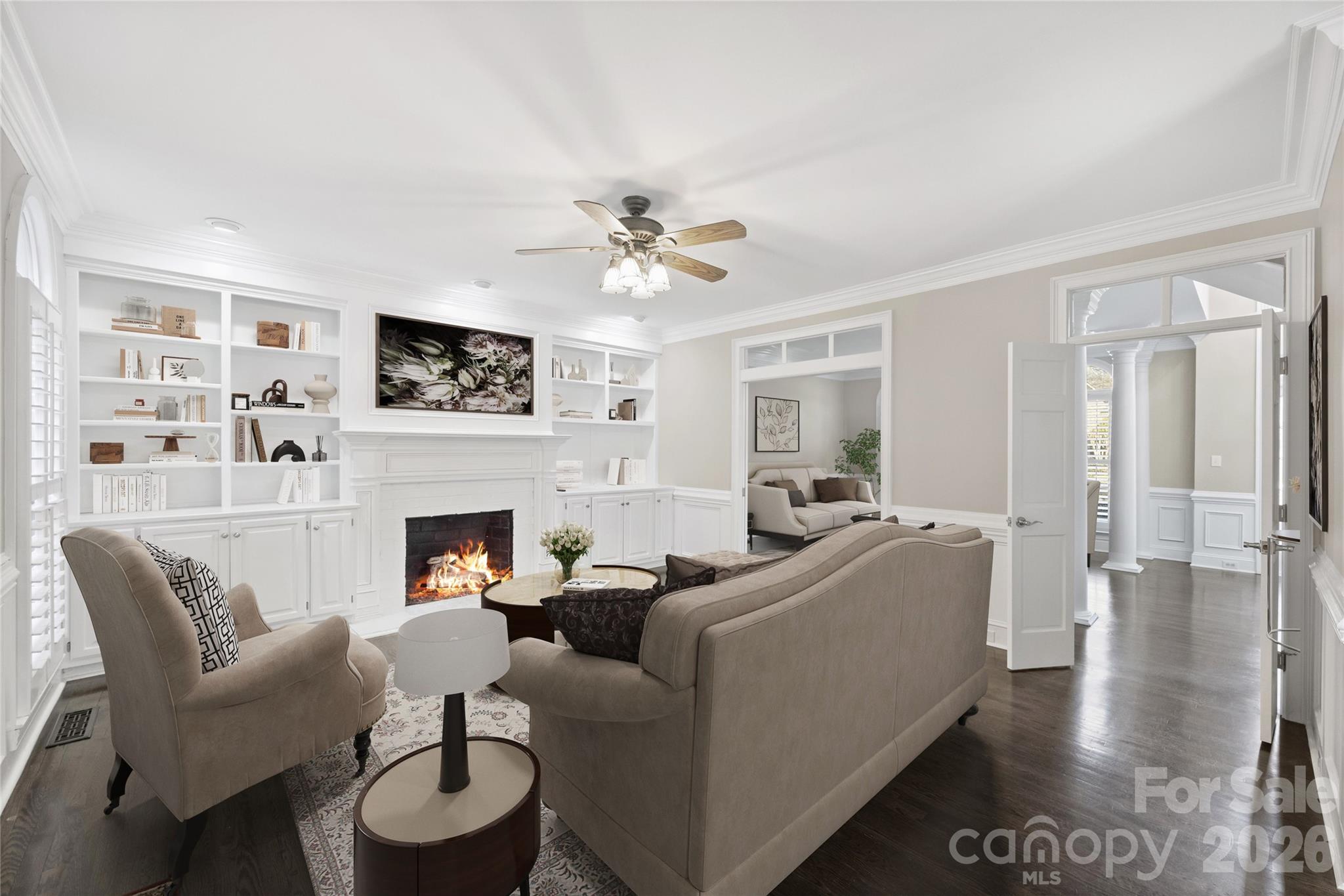 5242 Colony Road Charlotte, NC 28226 - Photo 10 of 34 a living room with furniture a fireplace and a flat screen tv
