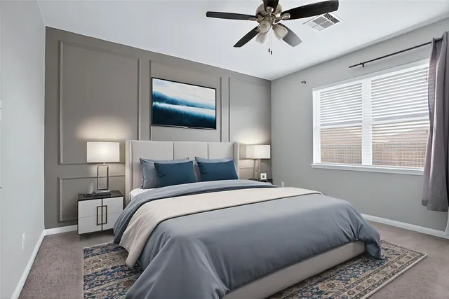 a bedroom with a large bed and a window