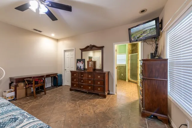 a bedroom with a bed and a cabinets