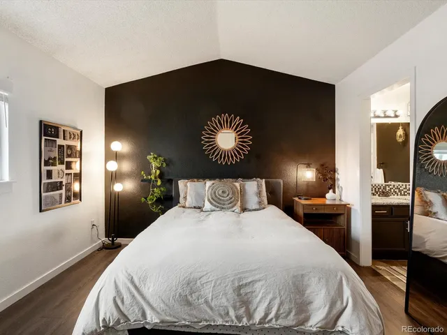 a bedroom with a bed and a couch