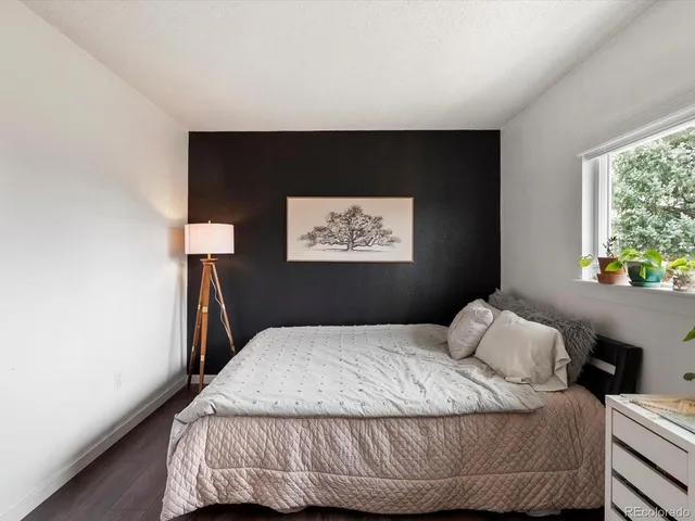 a bedroom with a bed and window