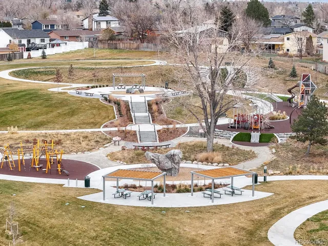a view of a water fountain and a big yard