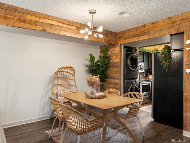 a dining room with furniture and chandelier