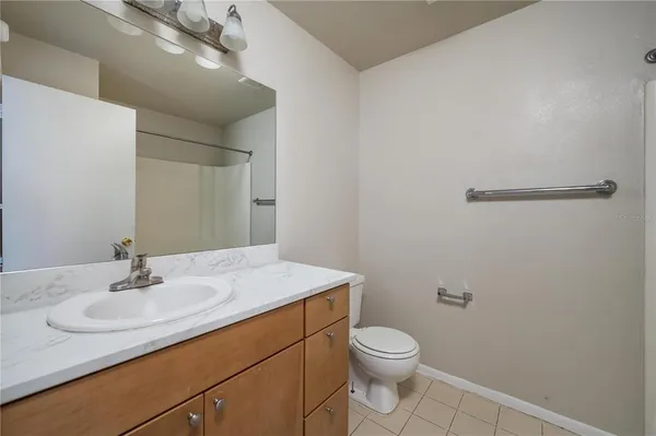 a bathroom with a sink toilet and vanity