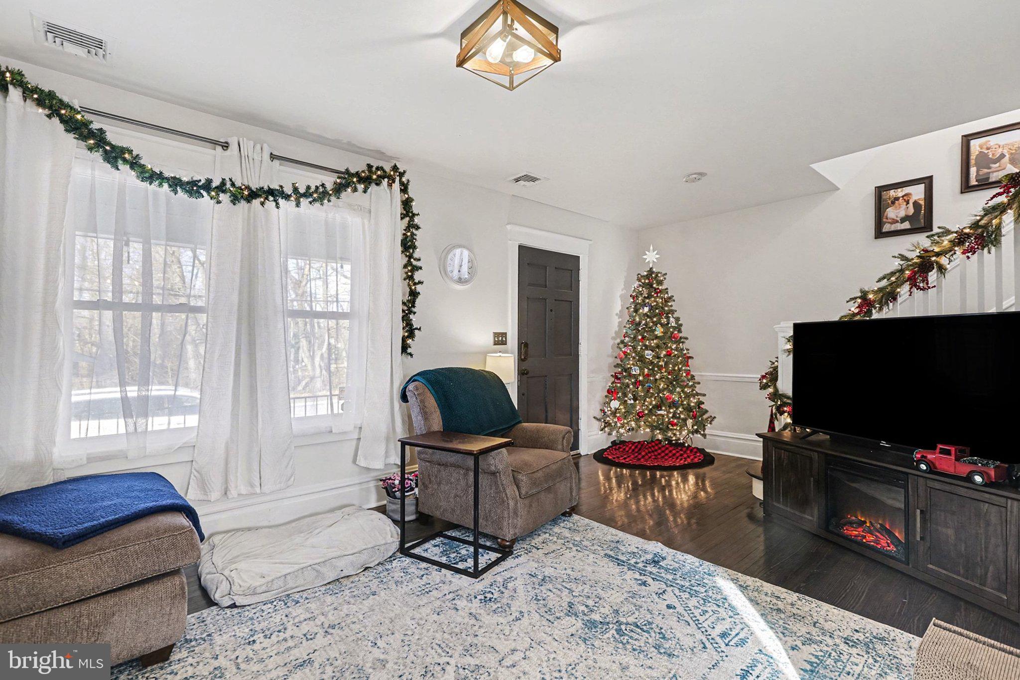 206 East Simpson Street Mechanicsburg, PA 17055 - Photo 13 of 30 a living room with furniture and a flat screen tv