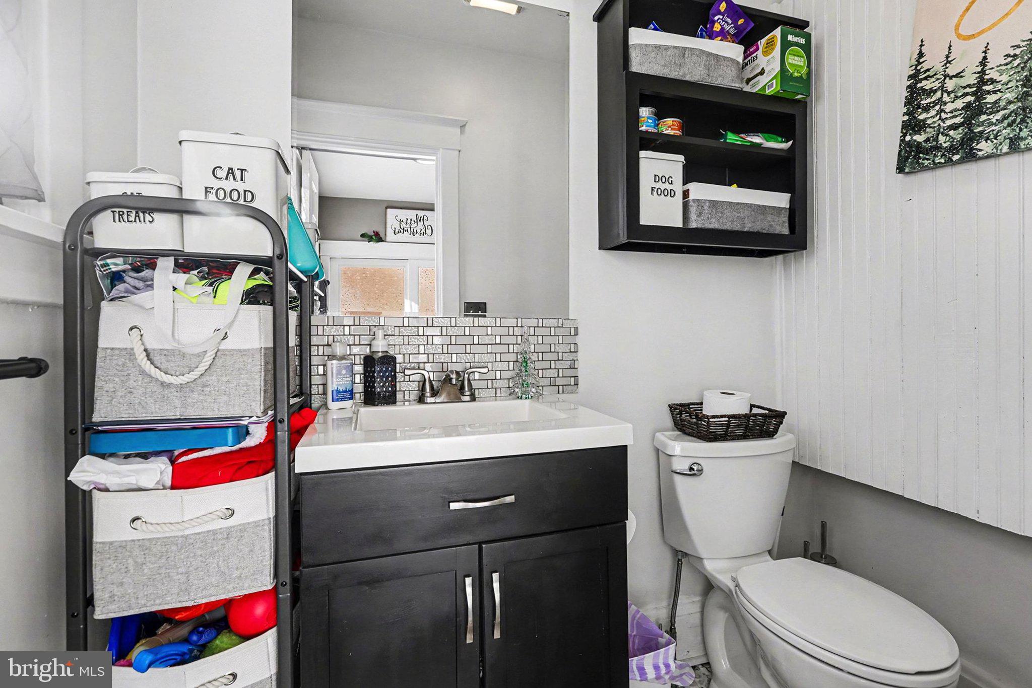 206 East Simpson Street Mechanicsburg, PA 17055 - Photo 14 of 30 a bathroom with a sink toilet mirror and vanity